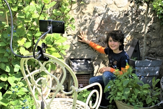 Little boy (Tristan) filming wildlife video